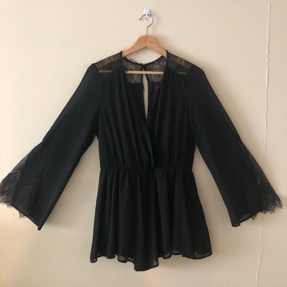 Black and lace flowy romper
